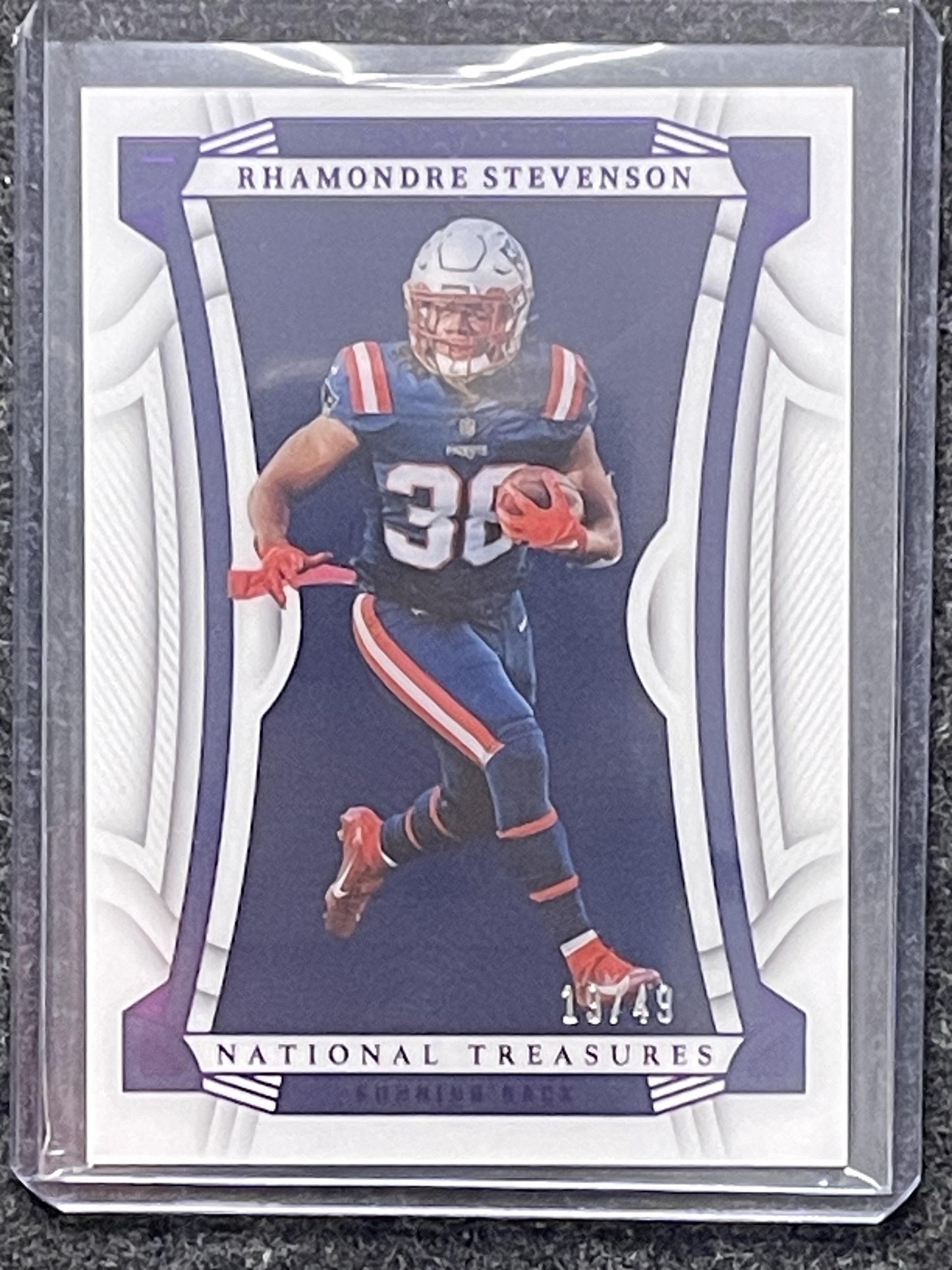2022 Panini National Treasures #8 Rhamondre Stevenson Purple #/49 Patriots SN