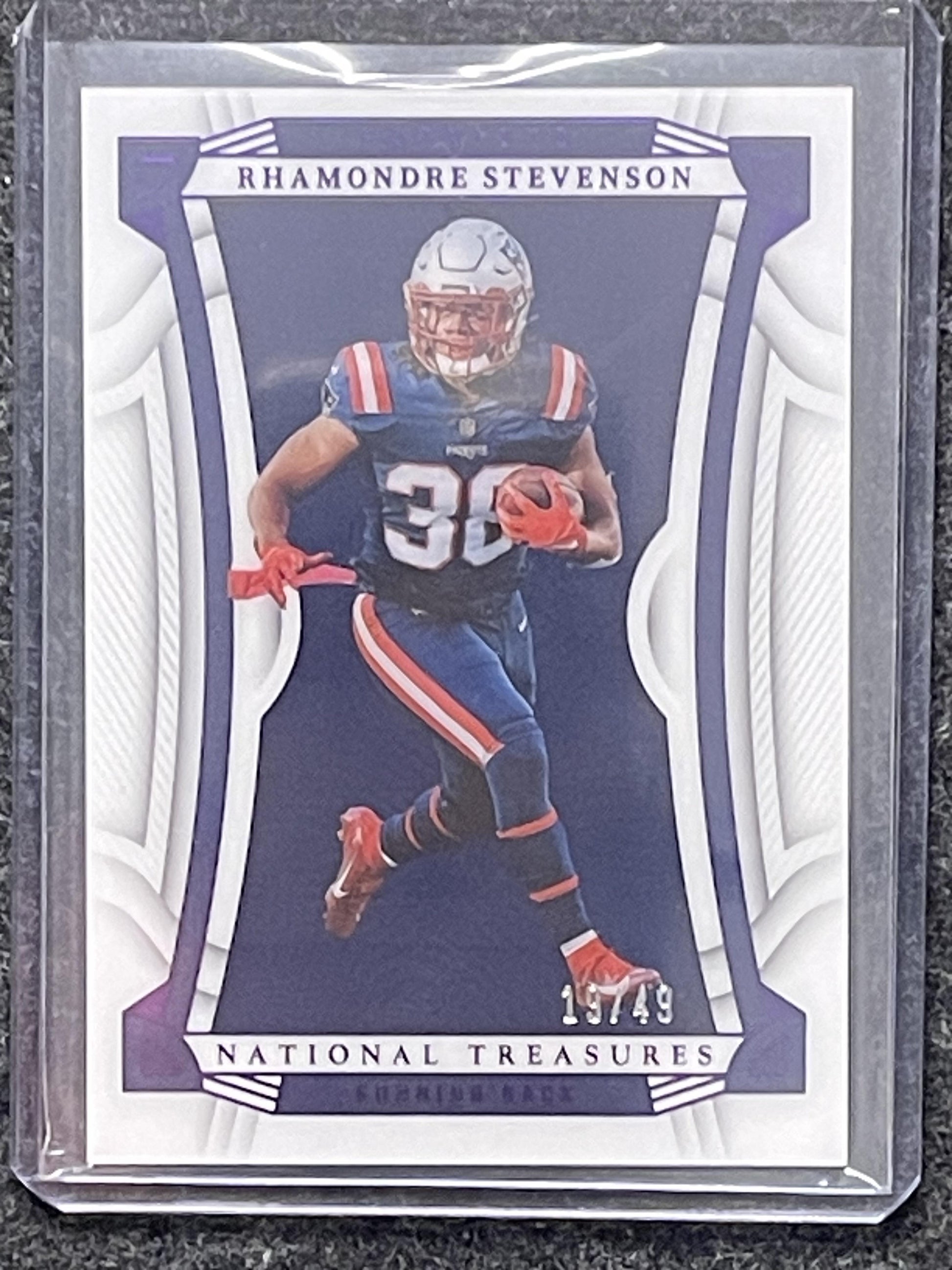 2022 Panini National Treasures #8 Rhamondre Stevenson Purple #/49 Patriots SN