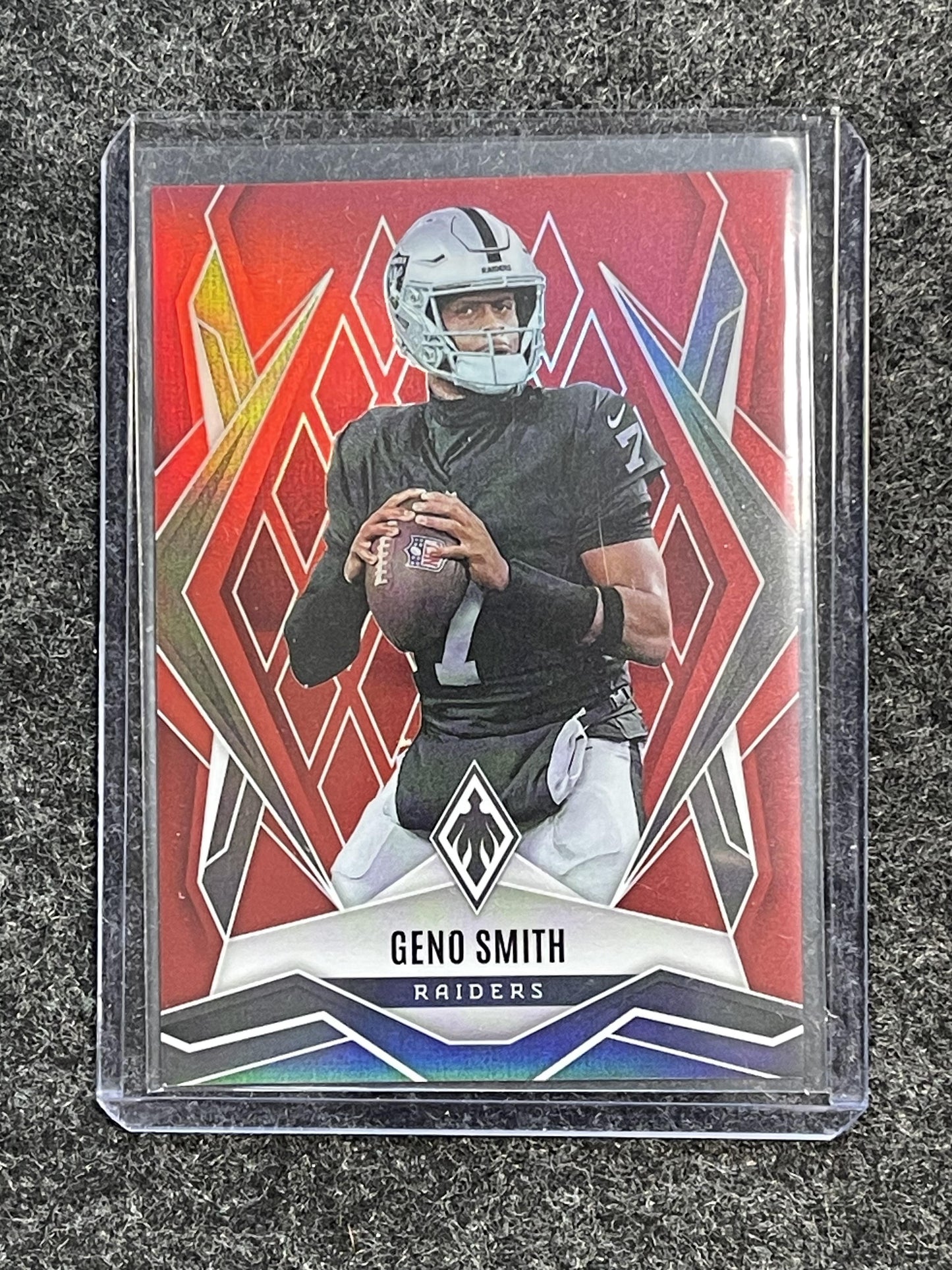 2025 Panini Phoenix #78 Geno Smith Red Seismic Prizm #/99 Las Vegas Raiders SN