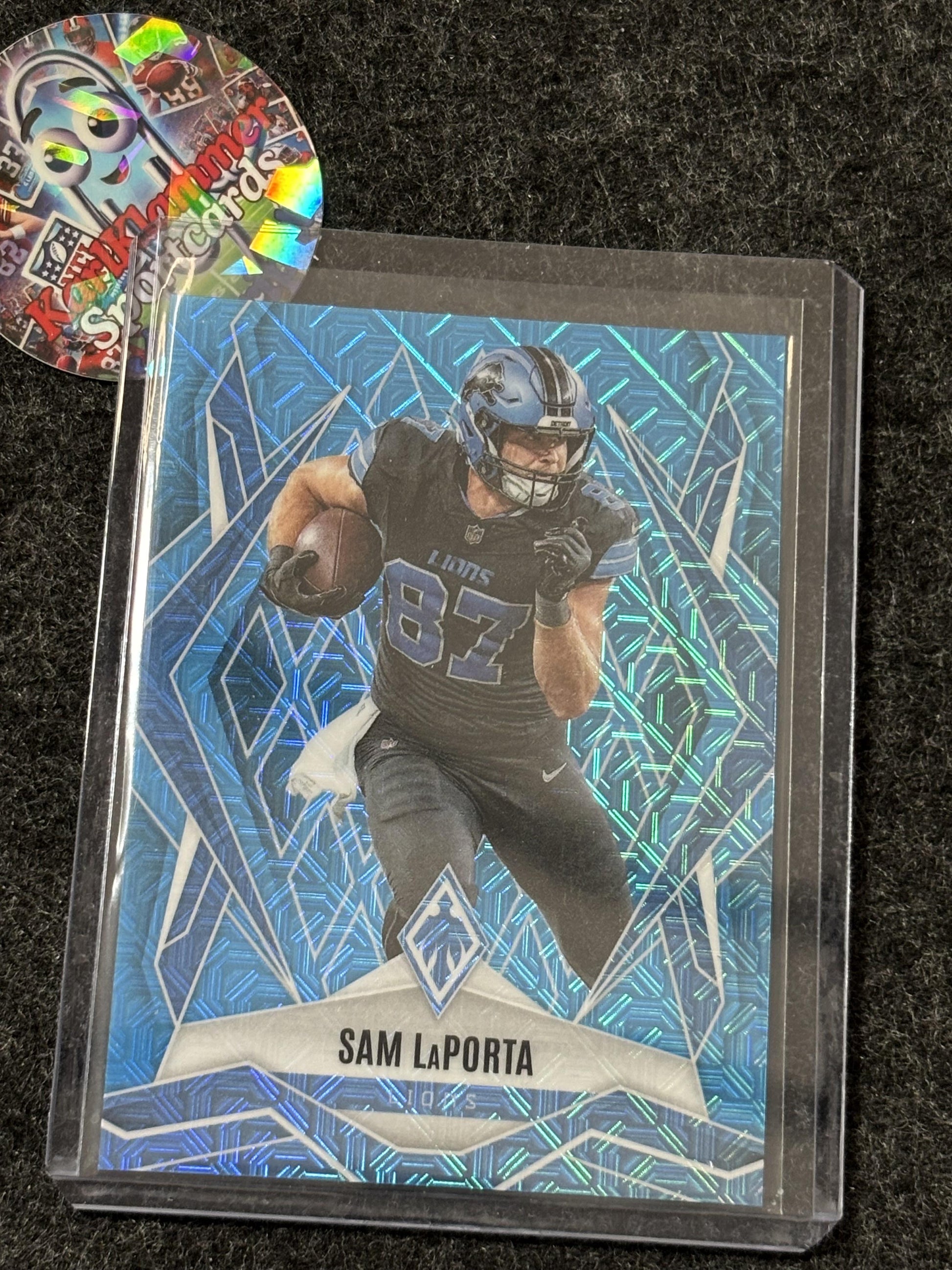 2025 Panini Phoenix #44 Sam LaPorta Light Blue Mojo Prizm #/85 Detroit Lions SN