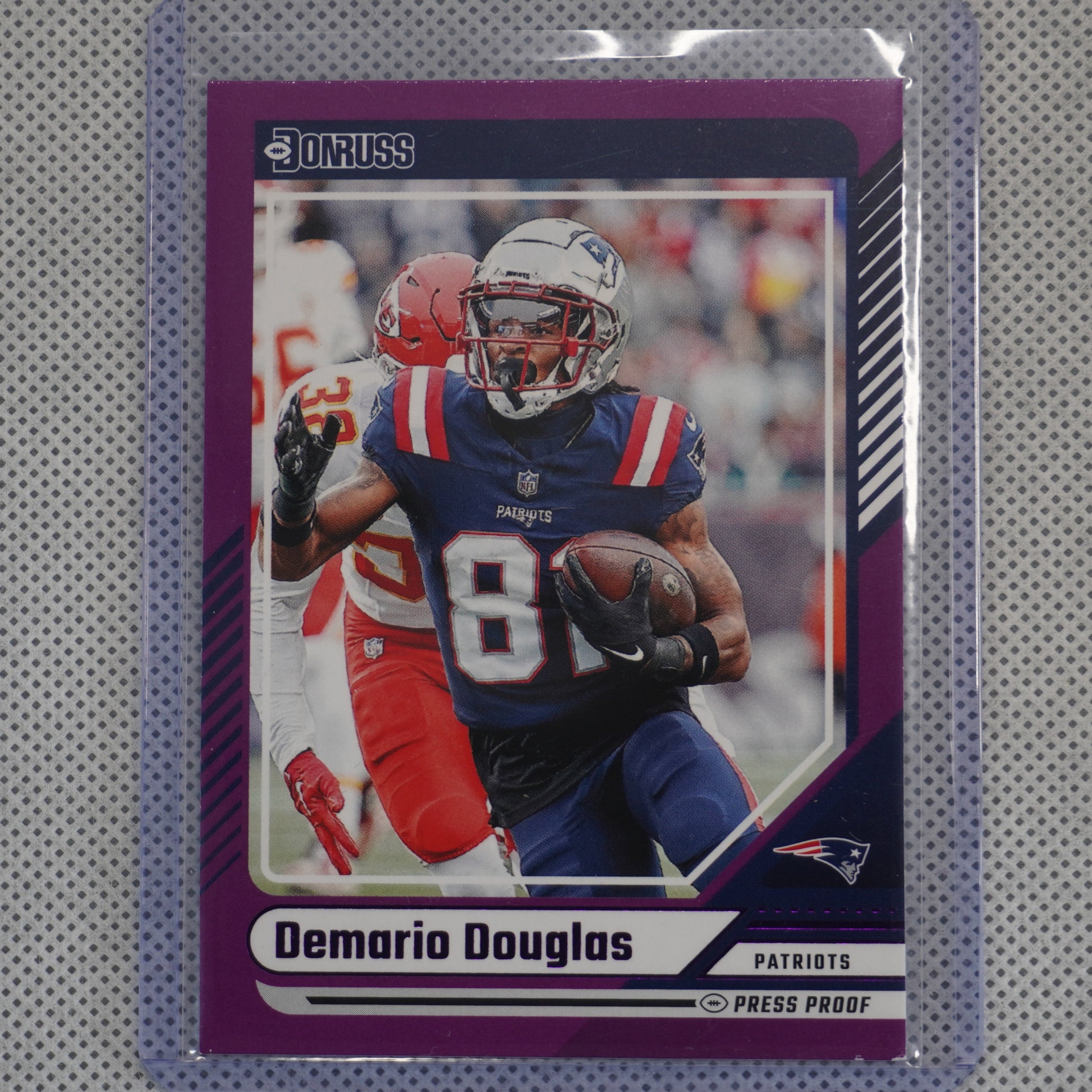 2024 Donruss #91 Demario Douglas Press Proof Purple New England Patriots