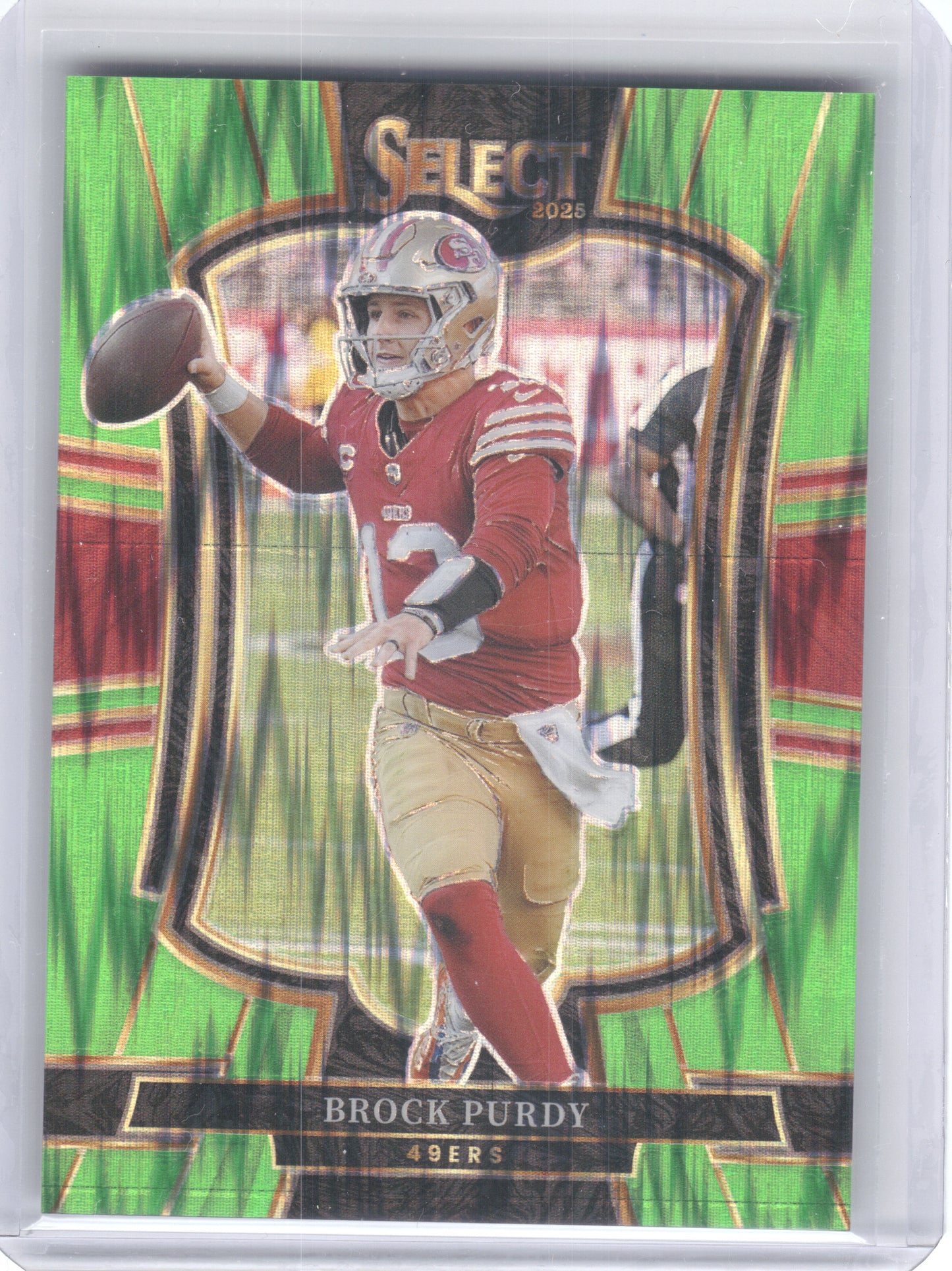 2025 Panini Select #117 Brock Purdy Neon Green Prizm Shock #/699 San Francisco 49ers SN