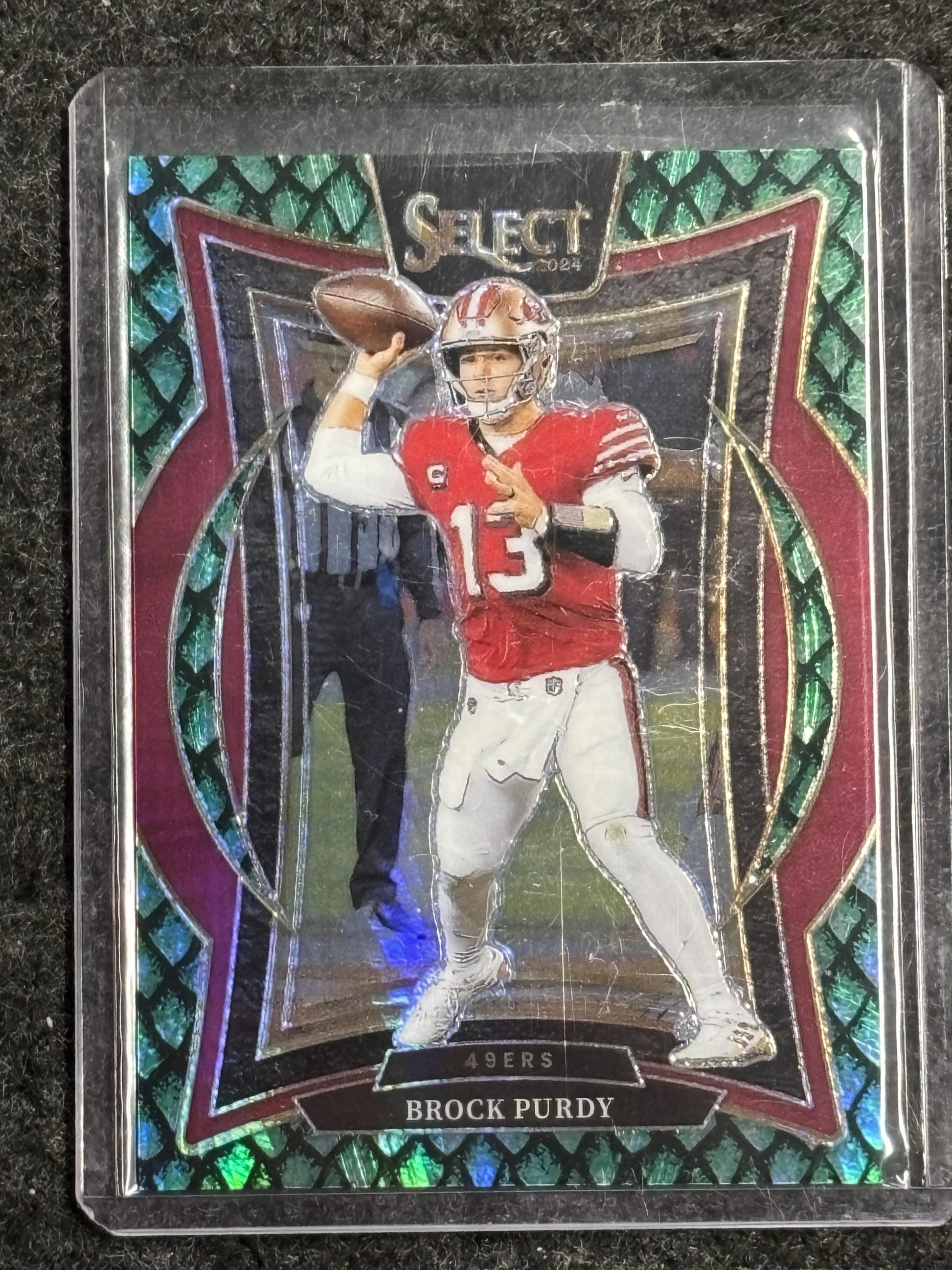 2024 Panini Select #37 Brock Purdy Dragon Scale Prizm #/81 San Francisco 49ers SN