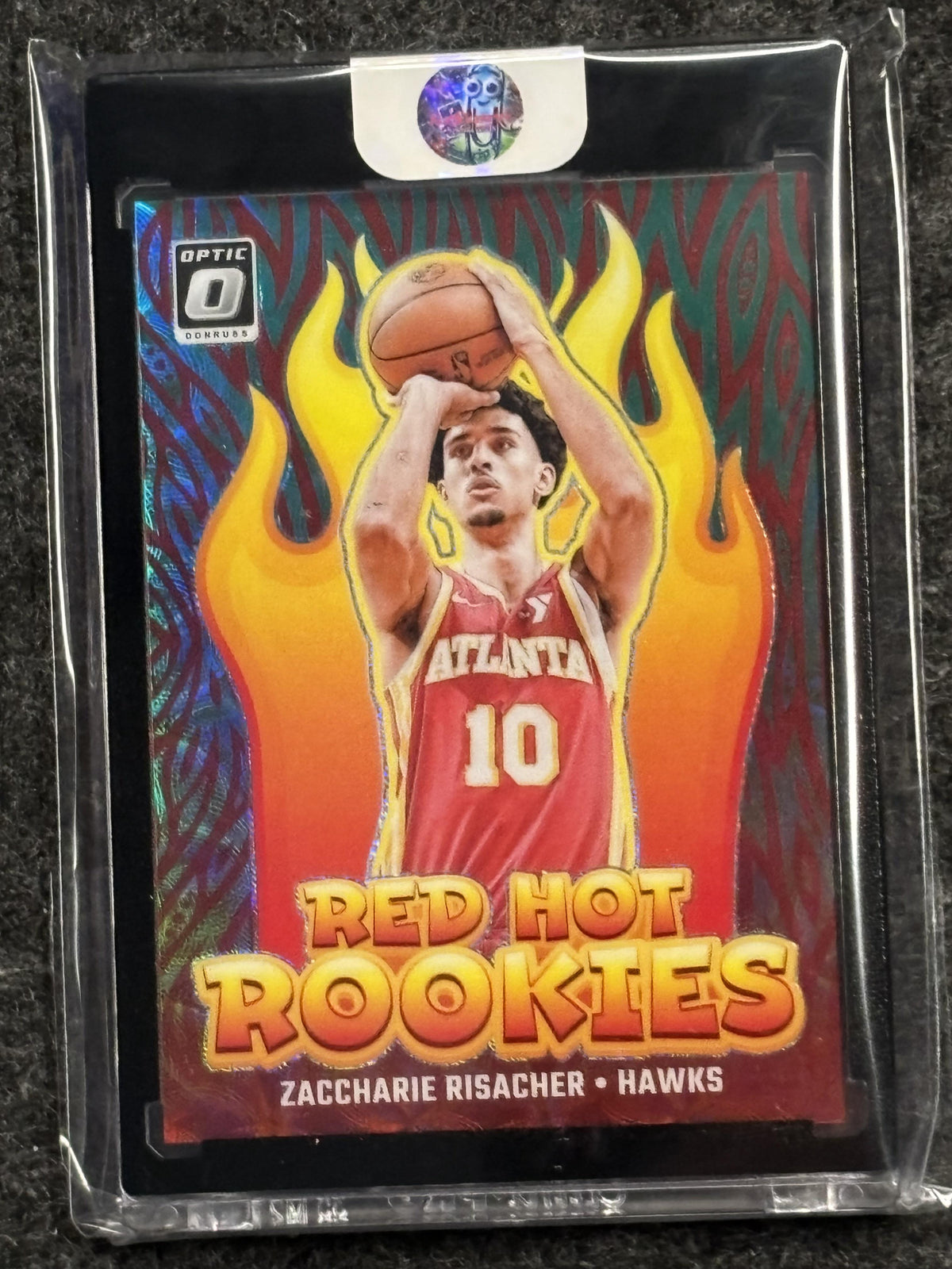 2024-25 Donruss Optic #9 Zaccharie Risacher Red Hot Rookies Green International #/25 Atlanta Hawks SN