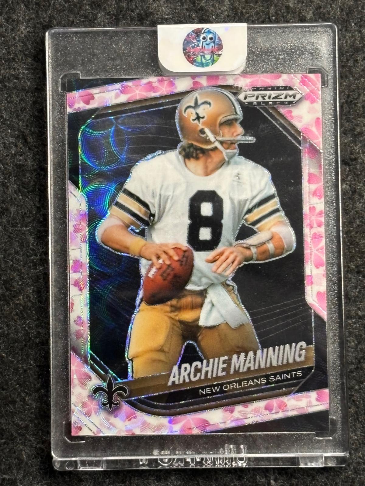 2025 Panini Prizm Black #97 Archie Manning Prizm Cherry Blossom #/20 New Orleans Saints SN